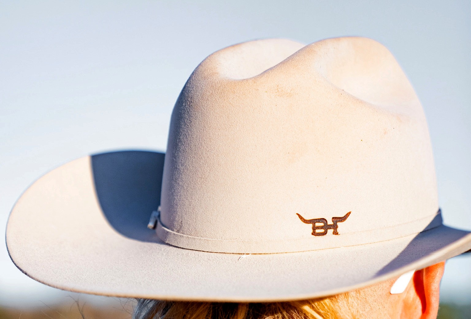 The BH longhorn brand burned into wood